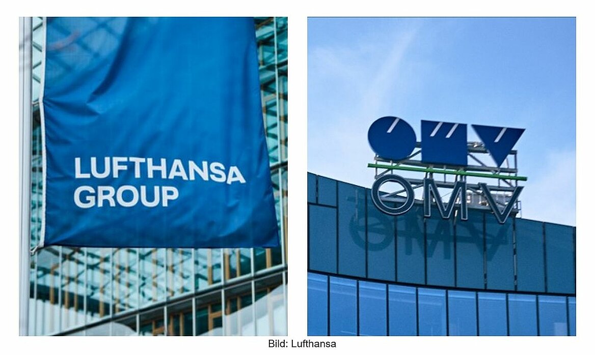 Blaue Fahne mit Lufthansa-Aufschritt links und OMV-Logo auf Bürogebäude rechts